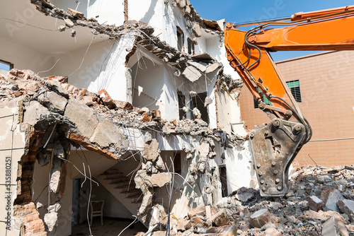 Construction machinery is demolishing the house