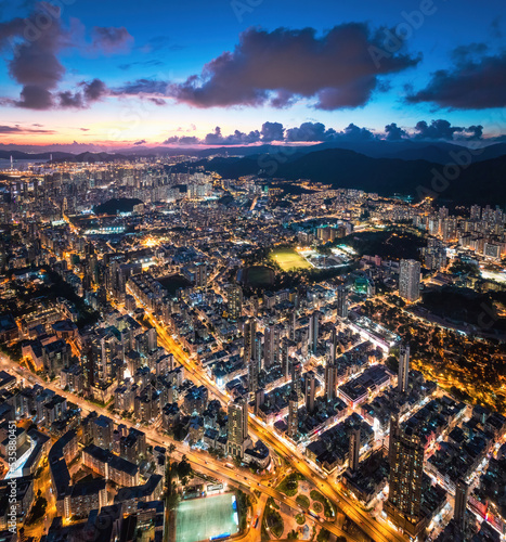 Epic night aerial view of the downtown of Kowloon, Towakwa and Hung Hom Area, Hong Kong photo