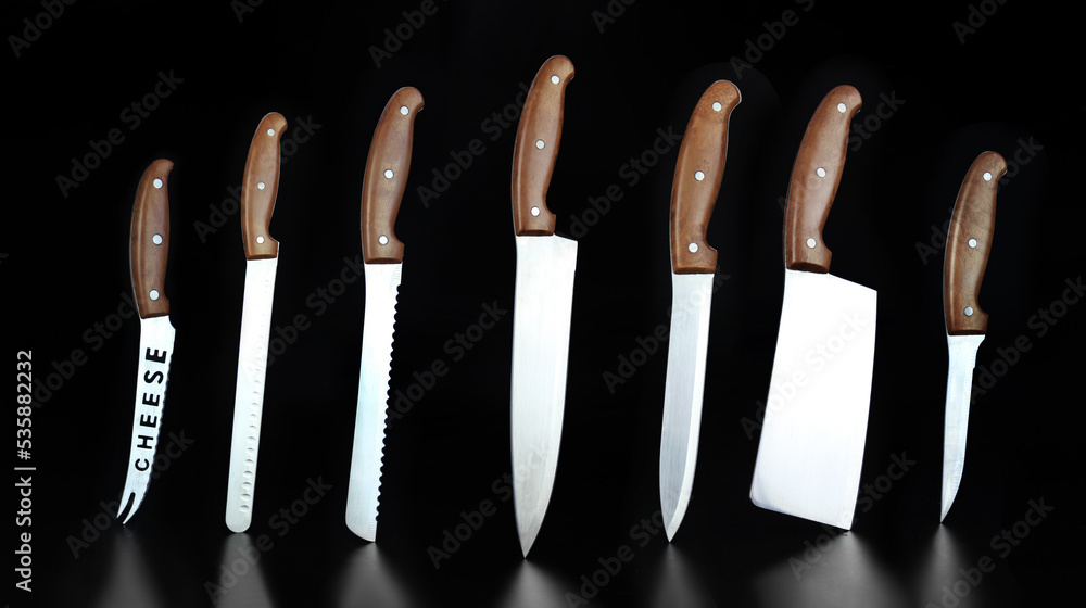 Steel kitchen knives. Quality Kitchen Knives. Set of new professional kitchen knives. Kitchen knife balanced on its end. Steel kitchen knives. Quality Kitchen Knives. Set of new professional kitchen knives. Kitchen knife balanced on its end.