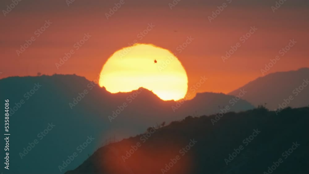 Sunset in Los Angeles, helicopter in the background of the sun Sunset in Los Angeles, helicopter in the background of the sun