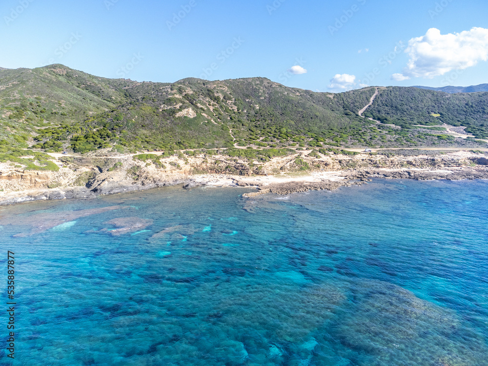 Aerial view of clear water by the rocky shore in Sardinia Aerial view of clear water by the rocky shore in Sardinia