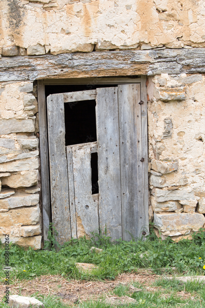 Farmland in Teruel mountains Aragon Spain. Old door detail.