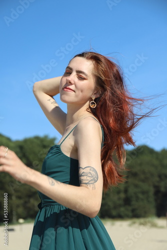 beautiful girl in a dress on the beach