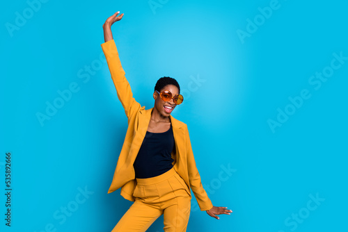 Portrait of cheerful carefree person have fun clubbing enjoy free time isolated on blue color background