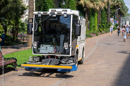 Compact cleaning machine sweeps a pedestrian street