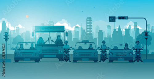 Cars and motorcycles are waiting for traffic lights in the city.