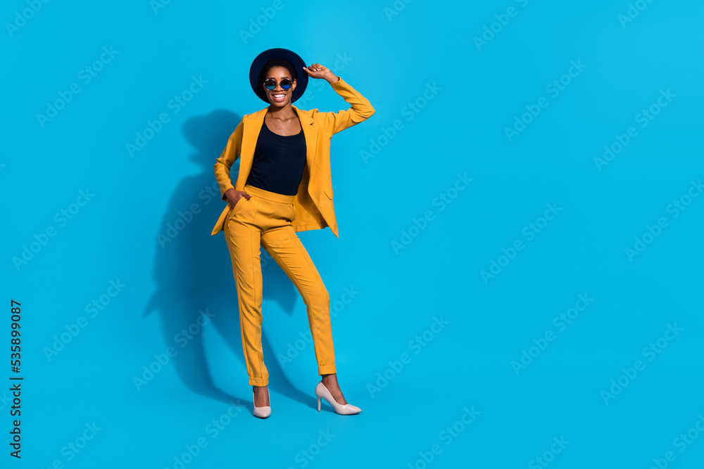 Full body photo of young cheerful man woman wear modern outfit headwear isolated over blue color background