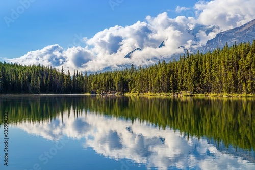 Tranquil Mountain Reflections On An Alberta Lake