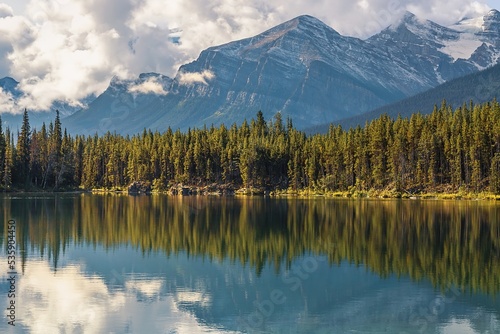 Fototapeta Naklejka Na Ścianę i Meble -  Reflection Of The Mountains On A Park Lake