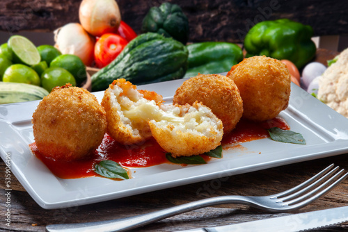 Fried rice balls. Traditional from Brazil where it is called Bolinho de arroz. photo