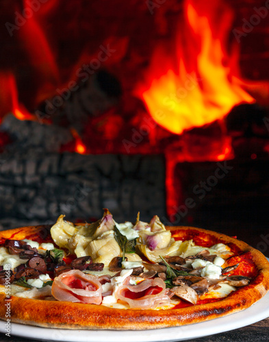 Baked pizza in the wood oven