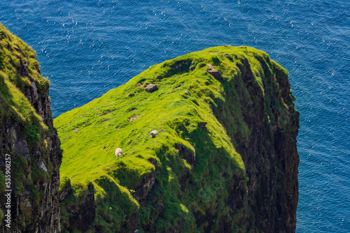 Dunnesdrangar is a name for the two 70 meter high sea stacks on Vágar island's south coast in Faroe islands. photo