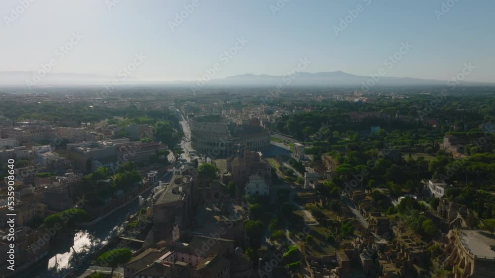 Forwards fly above waterfront. Tiber river lined by green trees passing through city centre. Rome, Italy Forwards fly above waterfront. Tiber river lined by green trees passing through city centre. Rome, Italy