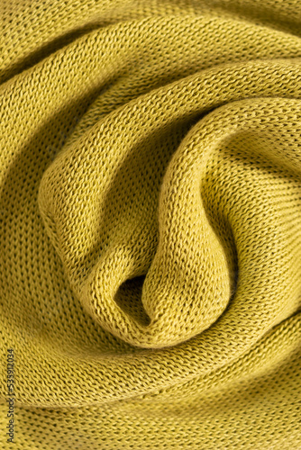Obraz na plátne Warm cozy green knitwear closeup, texture background