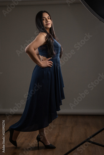 dancing in studio and wearing a long ball gown with heels a young woman with long hair, hobbies and lifestyle © Alejandro