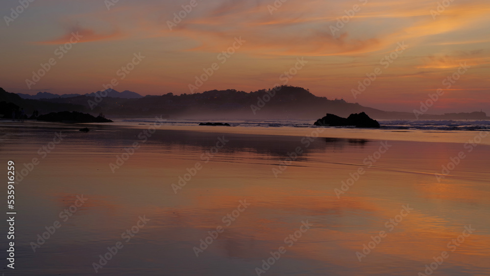 amanerer en la playa, orizonte