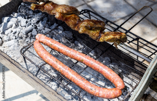 Typical Greek barbeque, with sausage and chicken