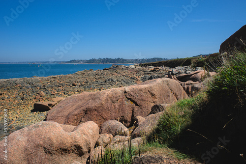 Monolithic blocks of pink granite in the Cotes d'Armor in Brittany, France. Pink granite coast