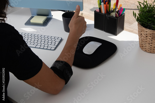one arm in a gesture of agreement