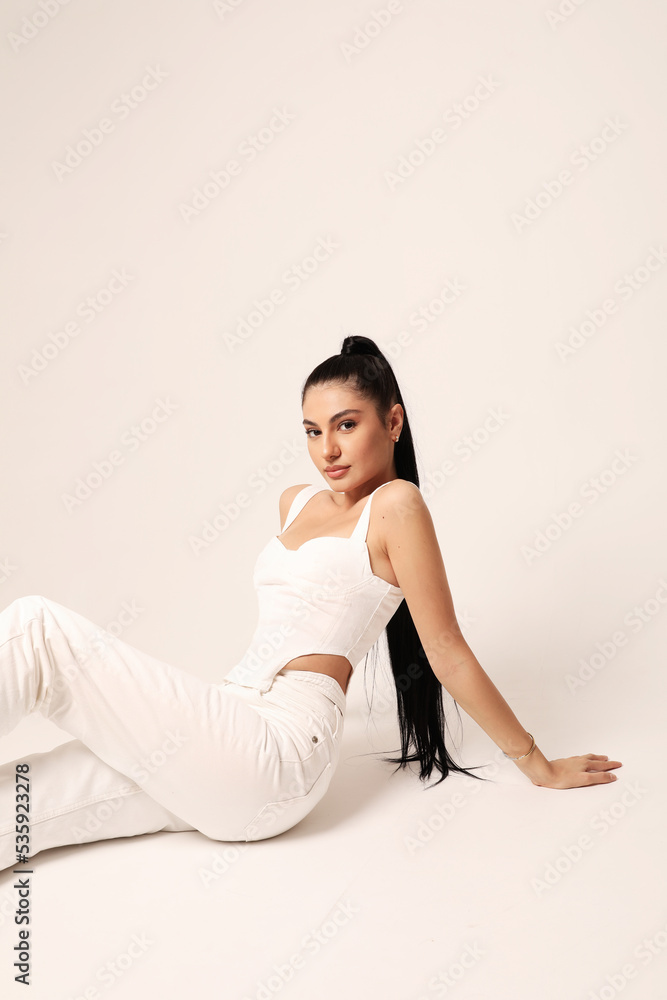 Beautiful young woman with long dark hair and soft make-up and perfect skin. Beautiful young woman with long dark hair and soft make-up and perfect skin.
