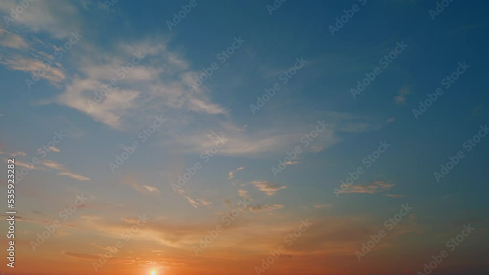 Beautiful sunset with cirrus clouds. Sun shines at the level of the horizon and warm orange tones colors. Timelapse. Beautiful sunset with cirrus clouds. Sun shines at the level of the horizon and warm orange tones colors. Timelapse.