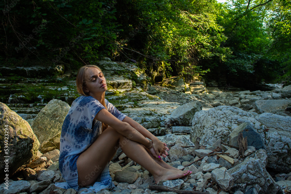 beautiful blonde in a swimsuit walks in the mountains beautiful blonde in a swimsuit walks in the mountains