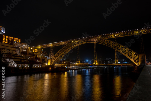 Night view of Dom Luis I bridge and the Douro River, in the city of Porto old town, Portugal. © Vitor Miranda