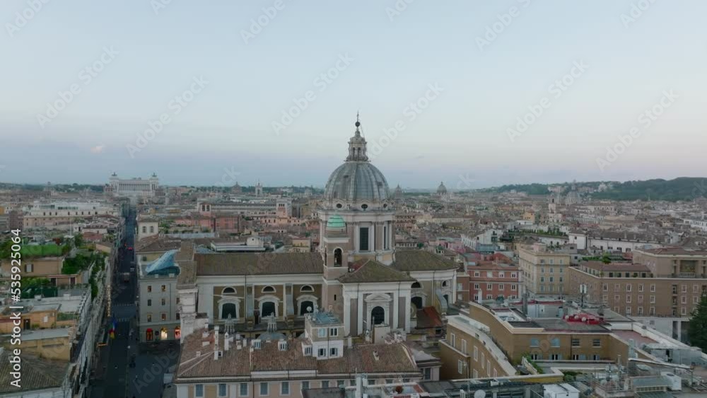 Aerial panoramic view of historic city centre at dusk. Large national Victor Emmanuel II Monument in background. Rome, Italy Aerial panoramic view of historic city centre at dusk. Large national Victor Emmanuel II Monument in background. Rome, Italy