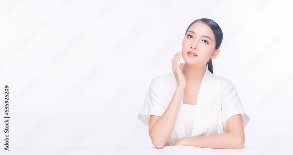 Banner Asian girl young woman perfect clear fresh skin touching chin smile on face. Teenager perfect treatment skin over isolated white background. Beauty, cosmetics, healthy, treatment, skincare spa. Banner Asian girl young woman perfect clear fresh skin touching chin smile on face. Teenager perfect treatment skin over isolated white background. Beauty, cosmetics, healthy, treatment, skincare spa.
