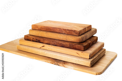 Set of brown, wooden, cutting boards of various sizes isolated on a white background.