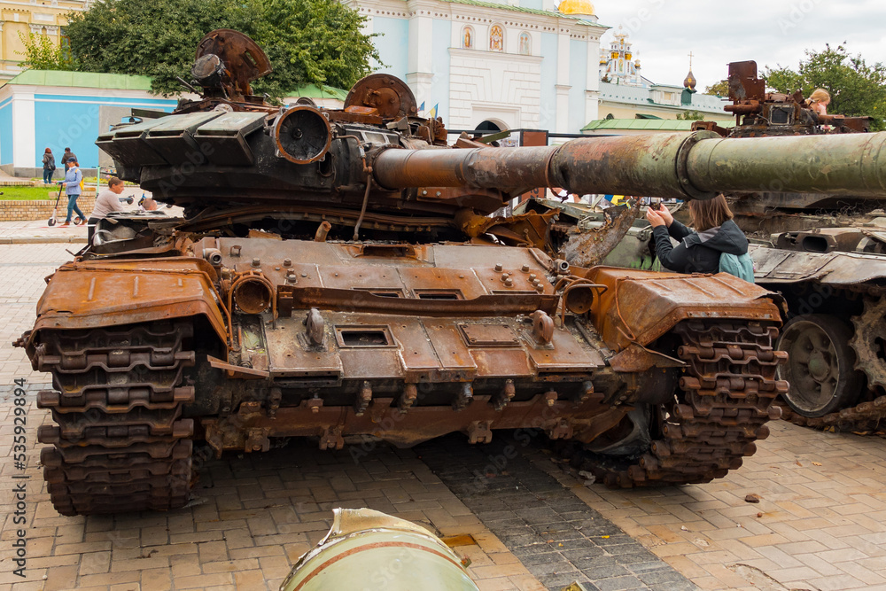 A destroyed rusty military tank turret stands outdoors on the street. Armored Vehicle. Armoring. Exploded. Fire. Transport. Violence. Armour. Armed. Wreck. Danger. Steel. Shell. Fragment A destroyed rusty military tank turret stands outdoors on the street. Armored Vehicle. Armoring. Exploded. Fire. Transport. Violence. Armour. Armed. Wreck. Danger. Steel. Shell. Fragment