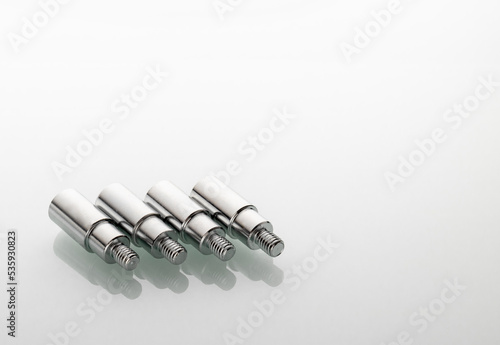 threaded metal tips for light stands with reflection in glass photo