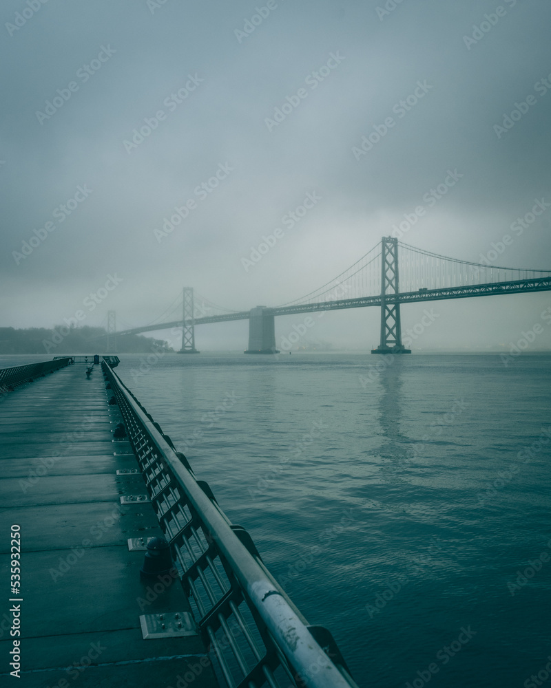 Pier 14 and the Bay Bridge on a foggy night, San Francisco, California
