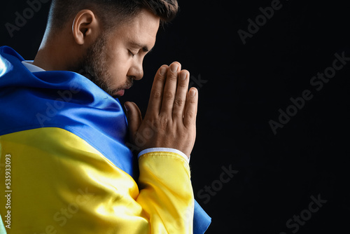 Young man with flag of Ukra...