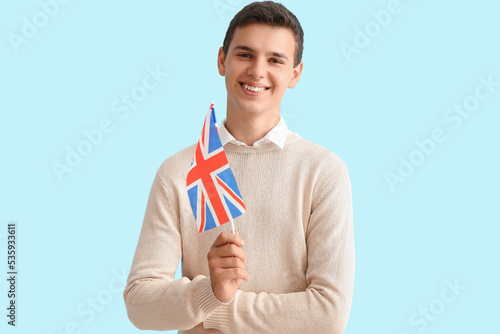 Teenage boy with UK flag on...