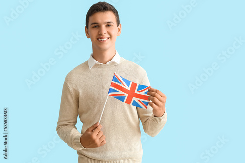 Teenage boy with UK flag on...