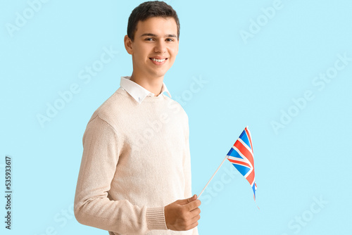 Teenage boy with UK flag on...