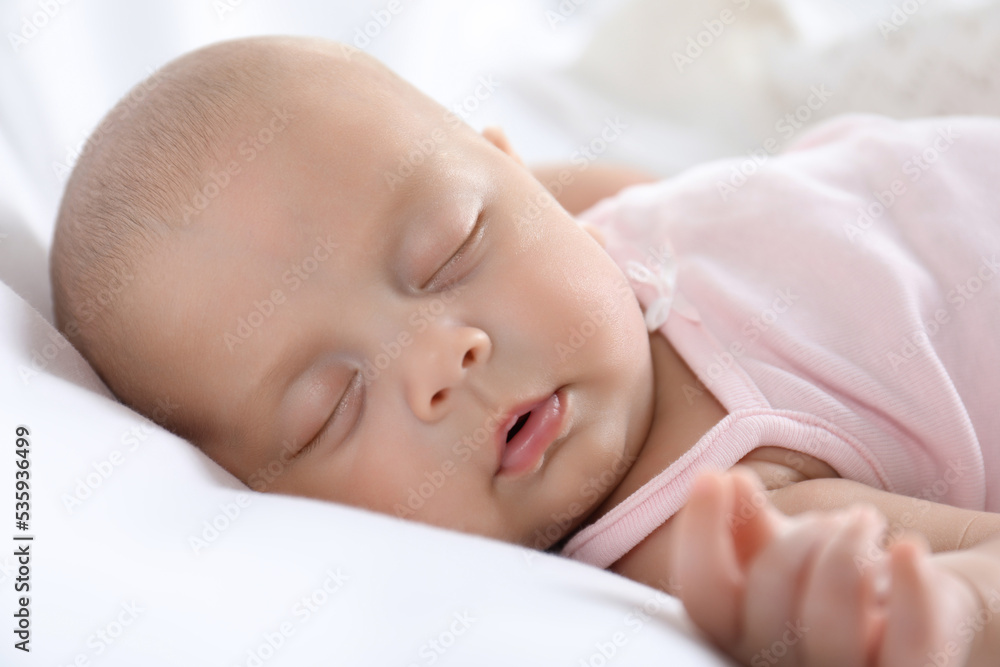 Cute little baby sleeping on bed, closeup Cute little baby sleeping on bed, closeup