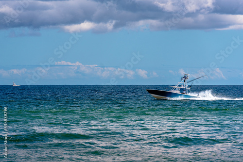 fishing boat going fast in ocean  © Matthew Tighe