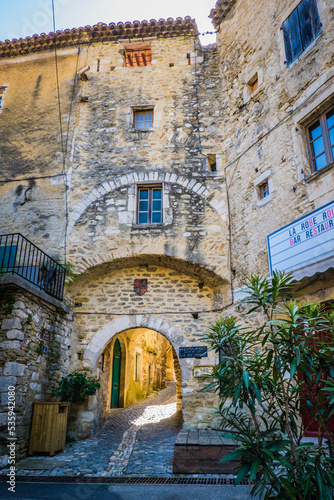 Fototapeta Naklejka Na Ścianę i Meble -  Narrow paved street and old houses in the medieval village of Saint Montan in the south of France (Ardeche)