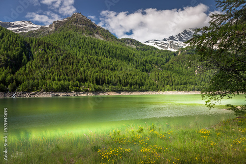 Alpine lake and dramatic landscape at springtime, Gran Paradiso alps , Italy