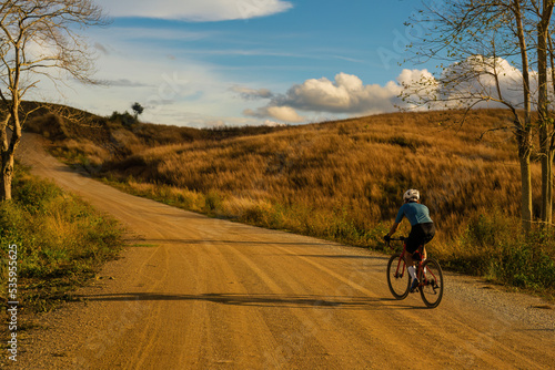 Cyclists practicing on gravel roads.