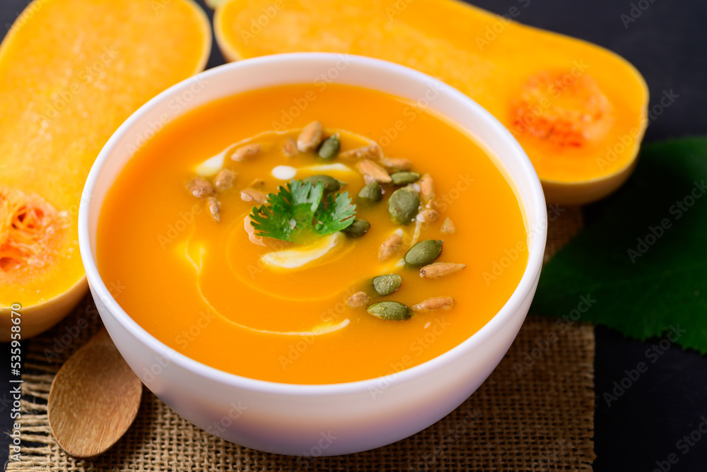 Butternut squash pumpkin soup in bowl, Homemade food in autumn season Butternut squash pumpkin soup in bowl, Homemade food in autumn season