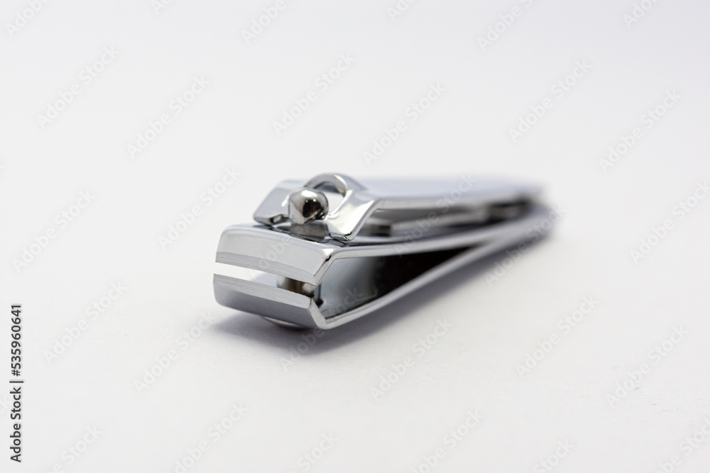 Clear nail clippers on a white floor Clear nail clippers on a white floor