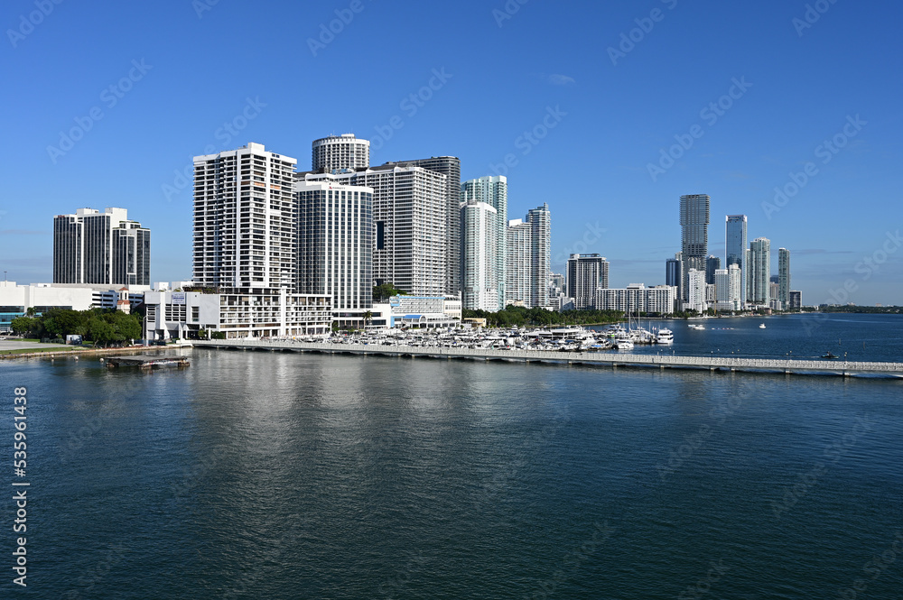 Residential waterfront buildings on Biscayne Bay in Miami, Florida on clear calm sunny autumn morning..
