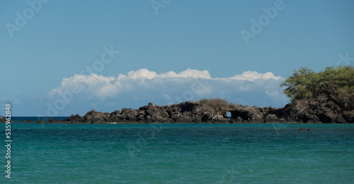 Cliff with a hole near Waialea beach