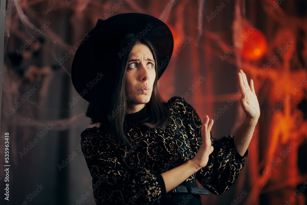 Scared Woman Pushing Away from a Spider Web Decoration. Unhappy person refusing and declining Halloween themed symbols
Scared Woman Pushing Away from a Spider Web Decoration. Unhappy person refusing and declining Halloween themed symbols