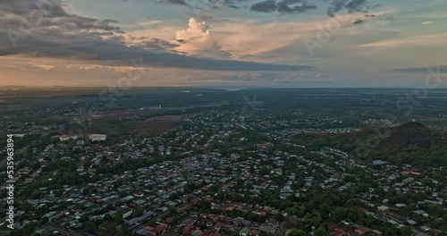 David Panama Aerial v12 flyover barrio el carmen, cinematic panning view capturing cerro san cristobal and townscape of ivu primavera neighborhood at sunrise - Shot with Mavic 3 Cine - April 2022 photo