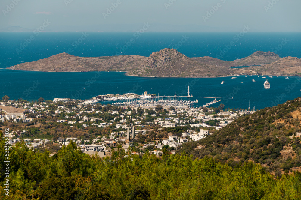 Bay in the city of Bodrum from the height of the suburban highway. Port and resort real estate.