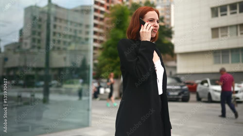 Beautiful redhead business woman talk on the phone at work Beautiful redhead business woman talk on the phone at work